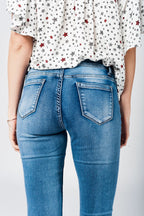 Skinny Jeans in Midwash with Busted Knees and Chewed Hems