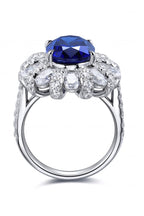 Oval Sapphire in Flower Shape CZ Ring