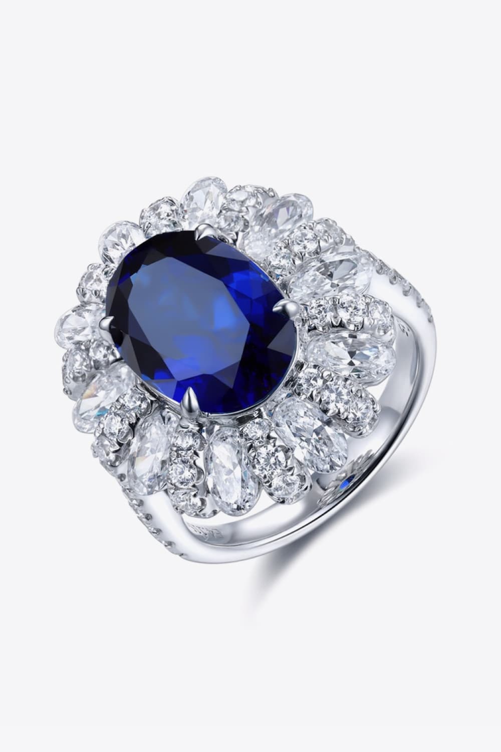 Oval Sapphire in Flower Shape CZ Ring